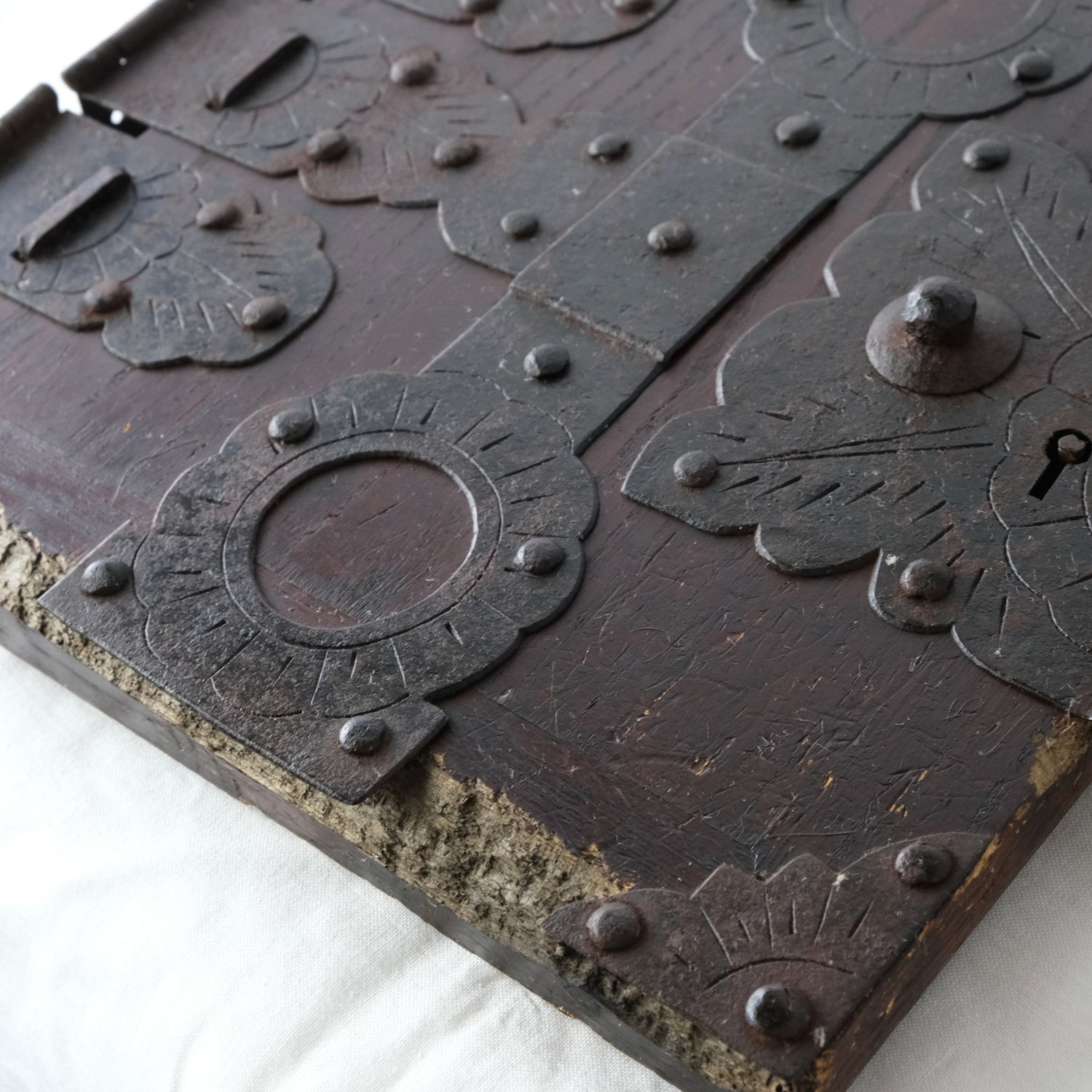 Detail of wood wear, surface scratches and metal fittings.