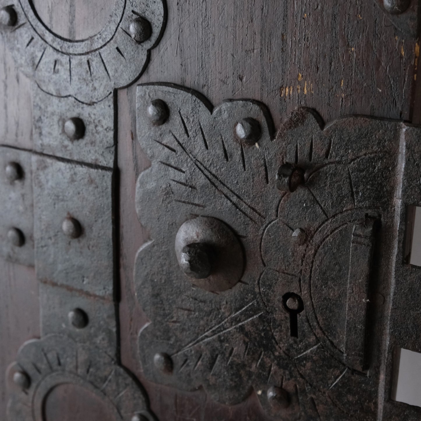Close-up of the decorative lock plate and keyhole on an antique Japanese funa tansu door.