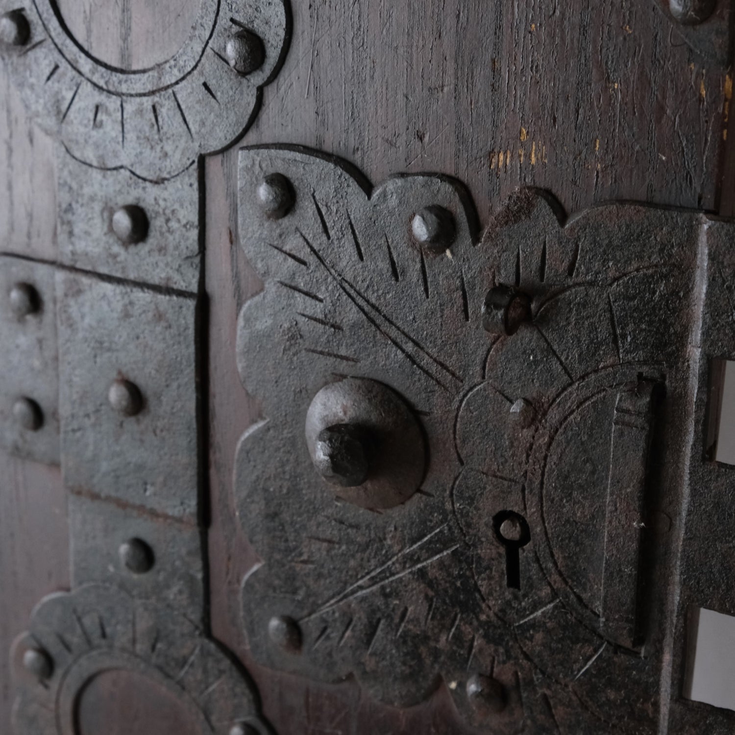Close-up of the decorative lock plate and keyhole on an antique Japanese funa tansu door.